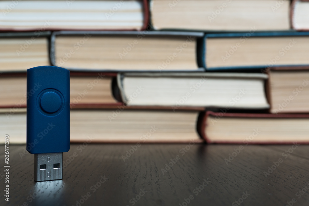 Stack books on wooden background. USB Stack books on wooden background. USB