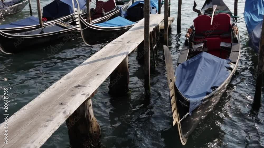 Traditional venice gondola boats in venice canals. Traditional venice gondola boats in venice canals.