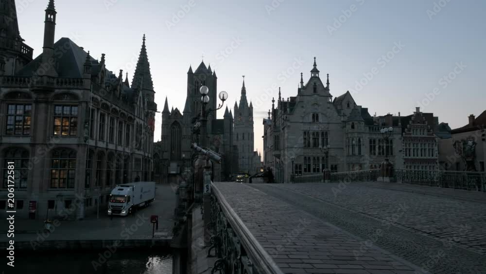 Camera slides across the railings of St Michael's Bridge in Ghent with the historic old town behind Taken during a spring morning twilight Camera slides across the railings of St Michael's Bridge in Ghent with the historic old town behind Taken during a spring morning twilight