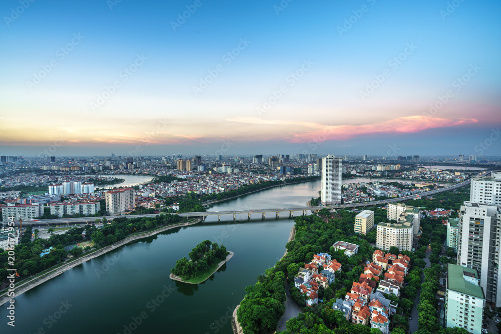 Fototapeta premium Aerial skyline view of Hanoi cityscape at twilight. Linh Dam peninsula, Hoang Mai district, Hanoi, Vietnam