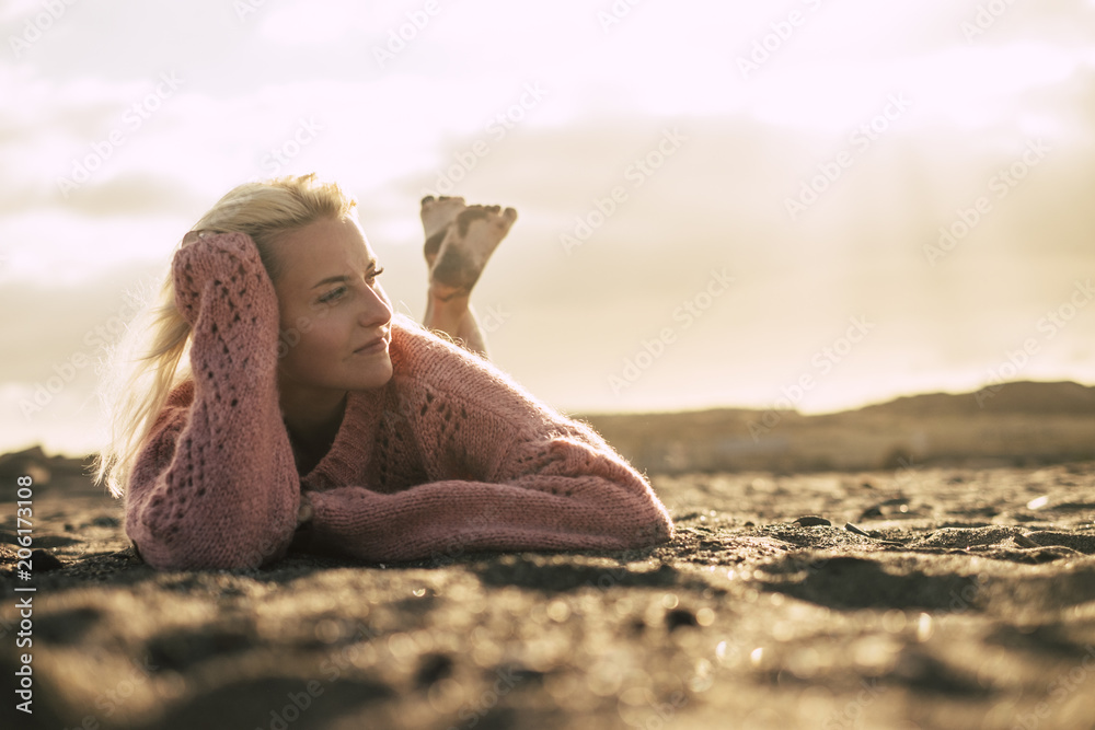 blonde-girl-sitting-on-beach