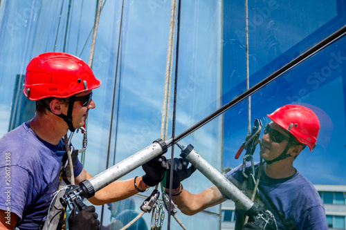 Obraz na plátně View on applying silicone sealant with gun on joints between windows