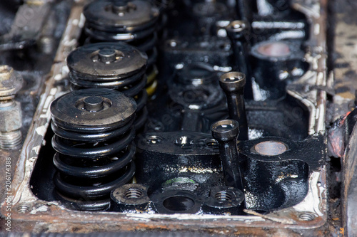 Details of a dirty diesel engine under the hood of an car