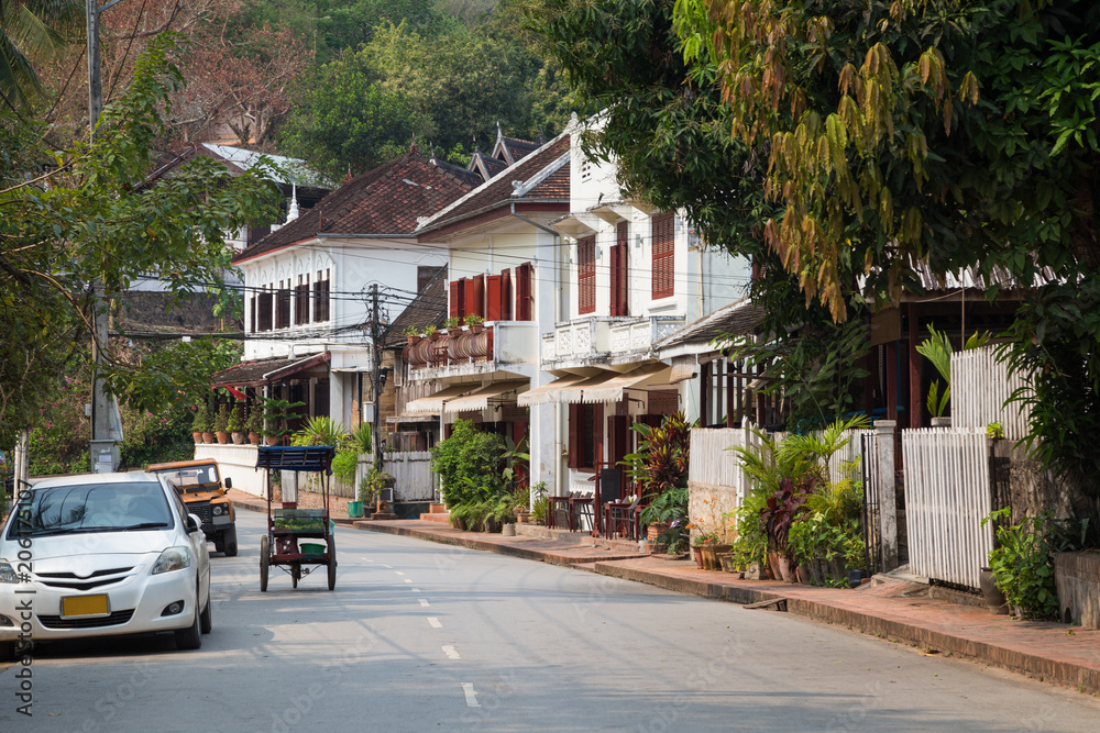 Quiet and idyllic Kingkitsarath Road in Luang Prabang, Laos, in the morning.