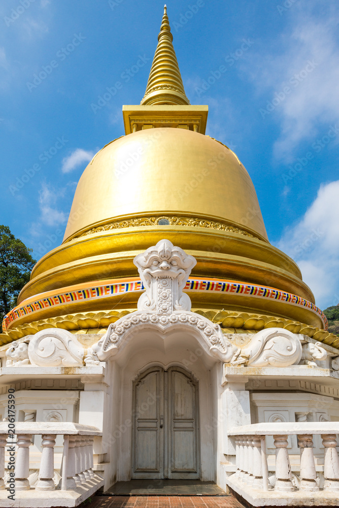 Stupa with golden dome in the Monastery of the Golden Temple Dambulla. The area is a world heritage site in Sri Lanka