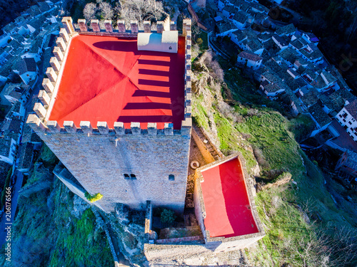 Aerial view of the "Cazorla" village castle, with its main tower rising above the village. Different angles and views. © Blazar Fotografía