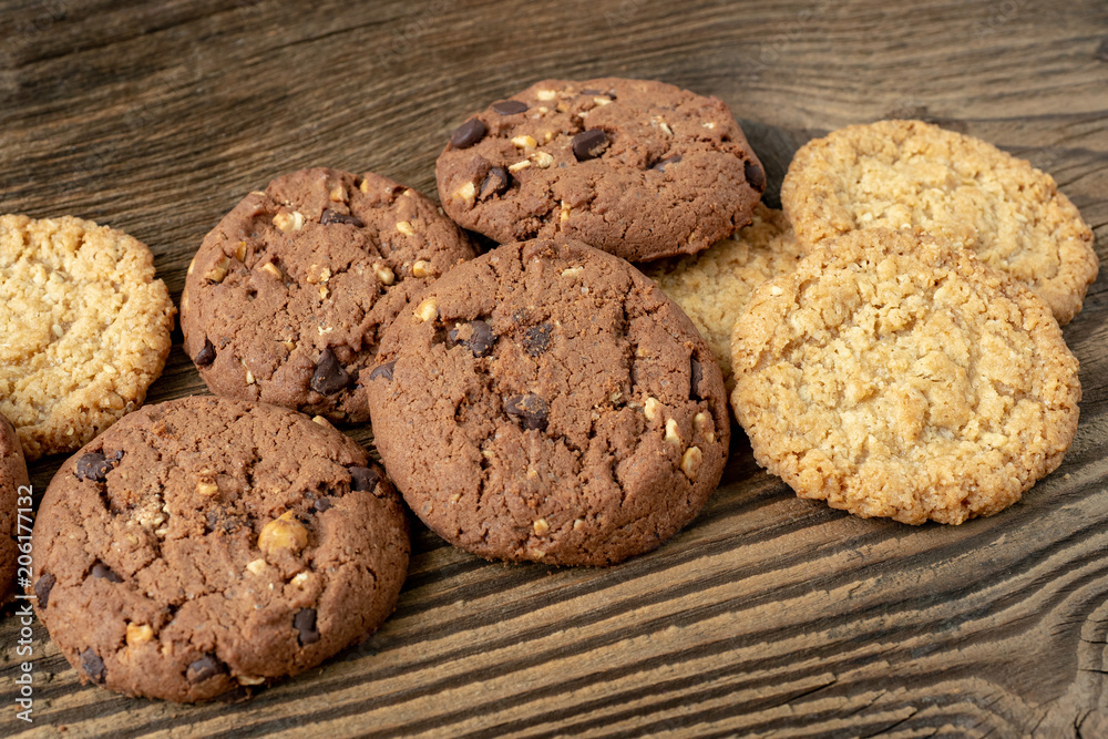 Various tasty cookies biscuits on wooden background Various tasty cookies biscuits on wooden background