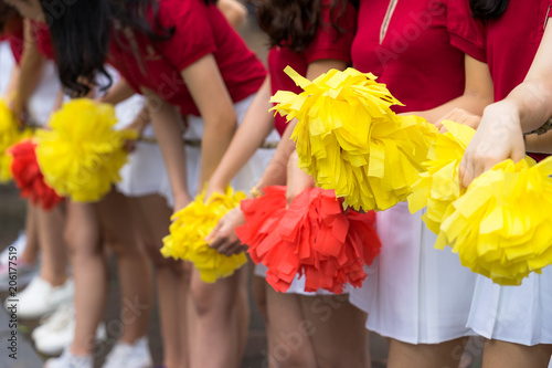 Asian young cheerleader group closeup with legs standing on row photo