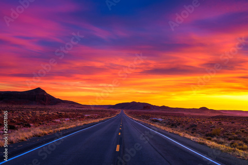 Dramatic sunset over an empty road in Utah