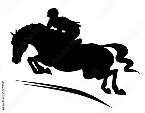 A silhouette of a rider on a horse jumping over an obstacle.
