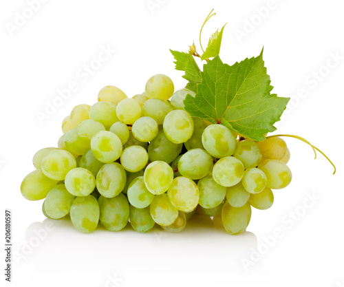 Fresh bunch of green grapes with leaves isolated on white background