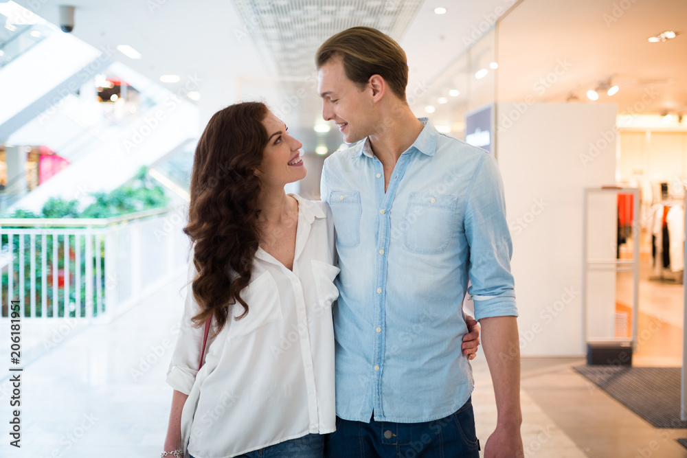 Couple walking in a shopping mall and having fun