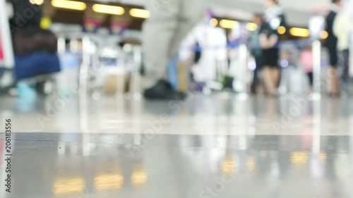 Slow motion blur people or tourist or passenger walking at airport terminal - background rush travel people in airport concept 