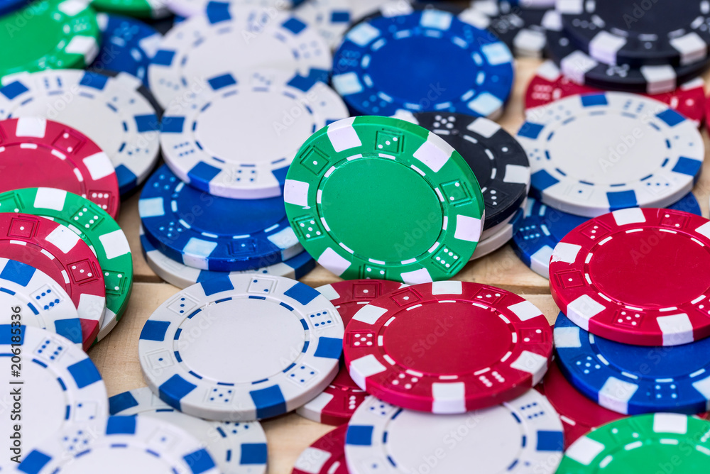 Colourful casino chips on the table closeup Colourful casino chips on the table closeup