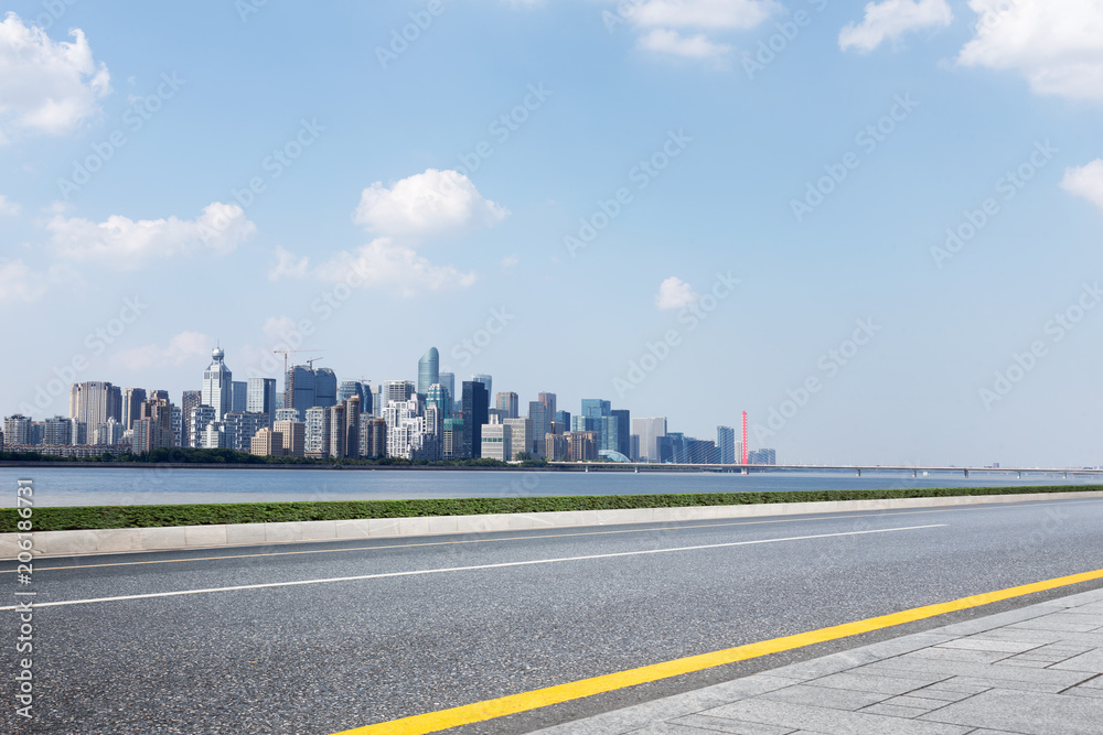 cityscape of modern city from empty asphalt road