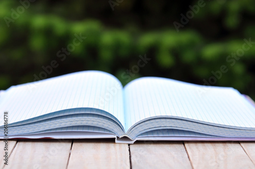 book with white empty pages on the table outdoor