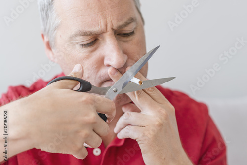 Business Man Hands Cutting Cigarettes Quit Smoking Concept.