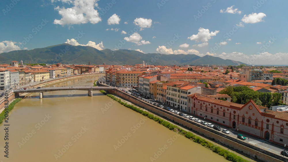 Aerial view of beautiful Lungarni in Pisa. Arno river and medieval buildings, Tuscany