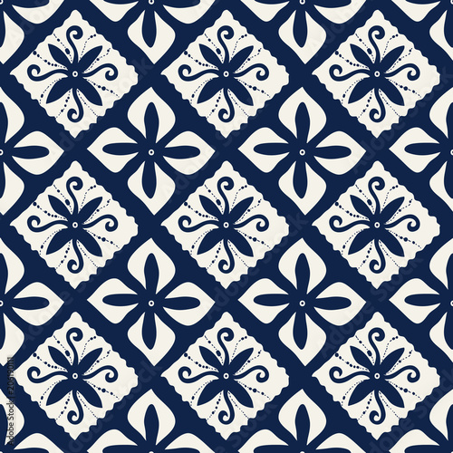 Seamless indigo dye woodblock printed damask pattern. Traditional oriental ornament of Indonesia, with flowers and double diamonds, ecru on navy blue background. Textile design.