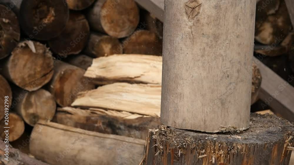 woodsheds and chopping firewood, lumberjack splitting wood with old axe. slow motion woodsheds and chopping firewood, lumberjack splitting wood with old axe. slow motion