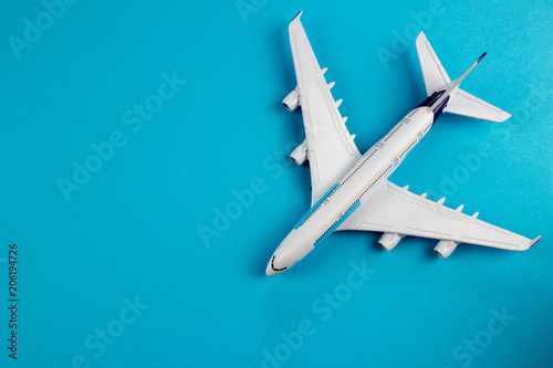 Plane, aircraft on blue background. Travel concept. Empty space for text and design