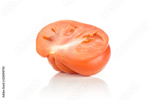 One beef tomato half isolated on white background big ripe red ribbing.
