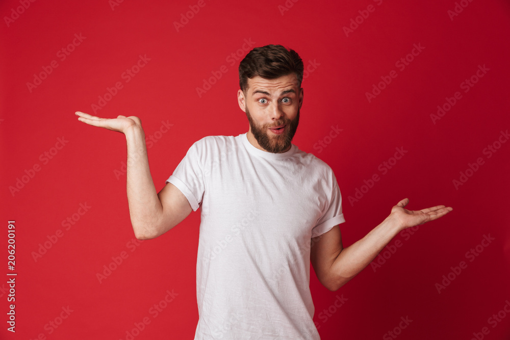 Emotional young handsome man showing copyspace. Emotional young handsome man showing copyspace.