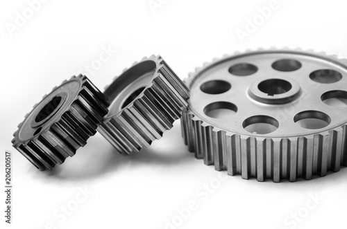 A gear wheel or pinion is a basic part of a gear train in the form of a disc with teeth on a cylindrical or conical surface meshing with the teeth of another gear