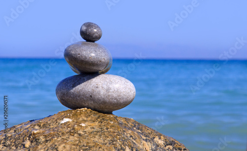 Spa stones balance on beach .