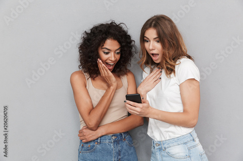 Portrait of two excited young women