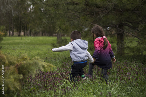 boy and girl having fun, exploring nature