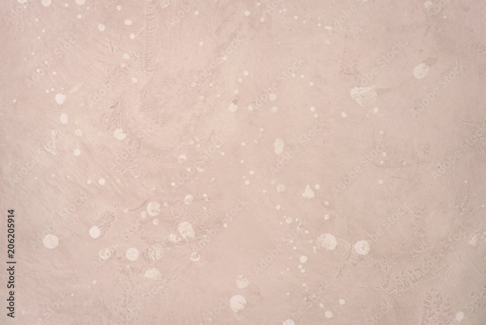 Light pink stone wall or floor.