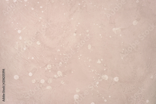Light pink stone wall or floor.
