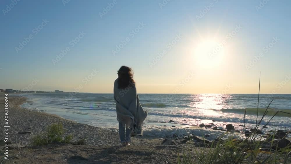Young woman with her dog relaxing on the beach. Young woman with her dog relaxing on the beach.