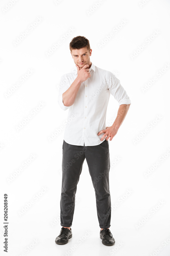Full length portrait of a pensive young man Full length portrait of a pensive young man