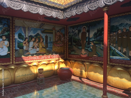Religious colorful 3-dimensional relics on the walls of Wat Preah Prom Rath Temple in Siem Reap, Cambodia. Relief paintings depicting the life of the Buddha