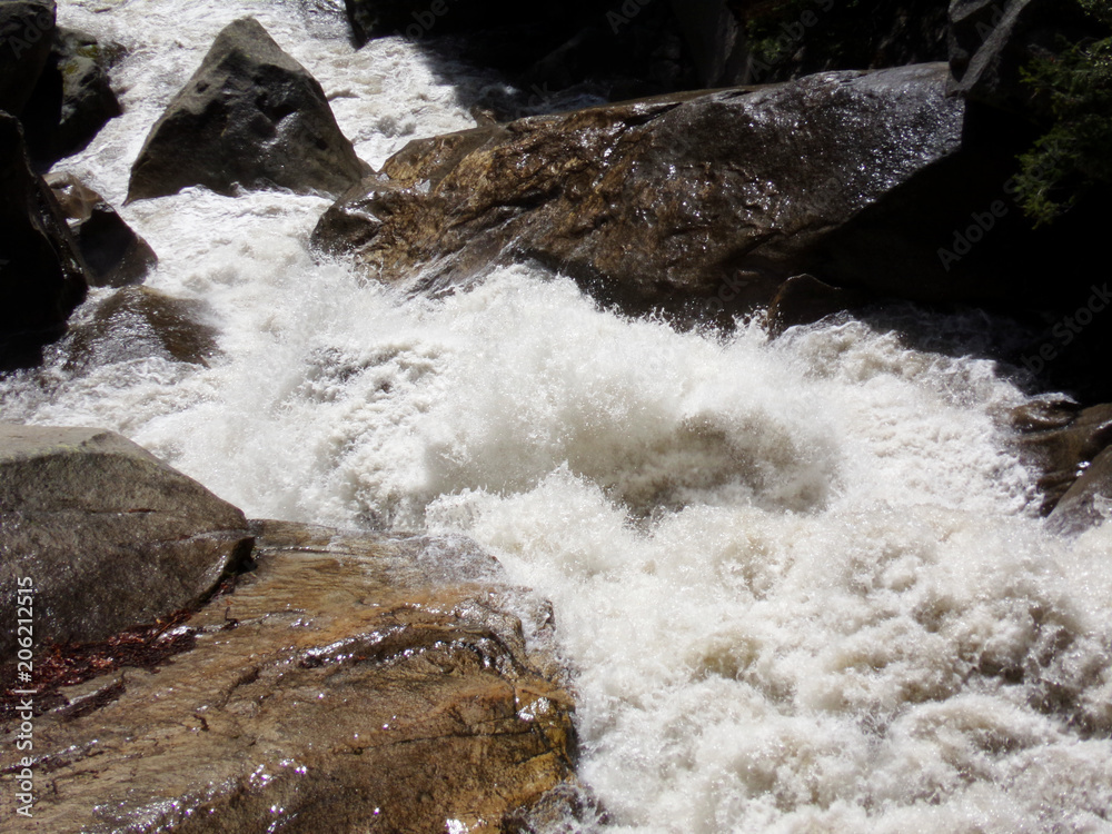 Rapids, wild water river between rocks - Yosemite National Park, Sierra Nevada, California Rapids, wild water river between rocks - Yosemite National Park, Sierra Nevada, California