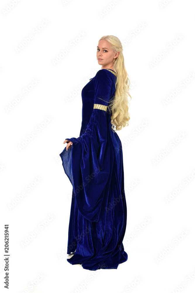 full length portrait of pretty blonde lady wearing a blue fantasy medieval gown. standing pose on white background. full length portrait of pretty blonde lady wearing a blue fantasy medieval gown. standing pose on white background.