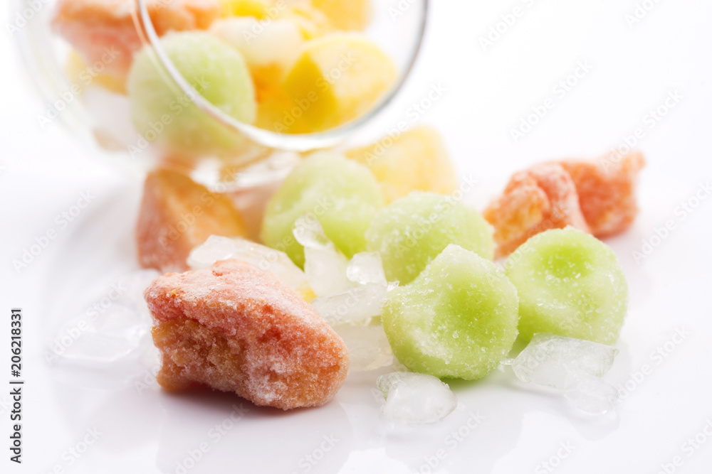 frozen exotic fruits on white background