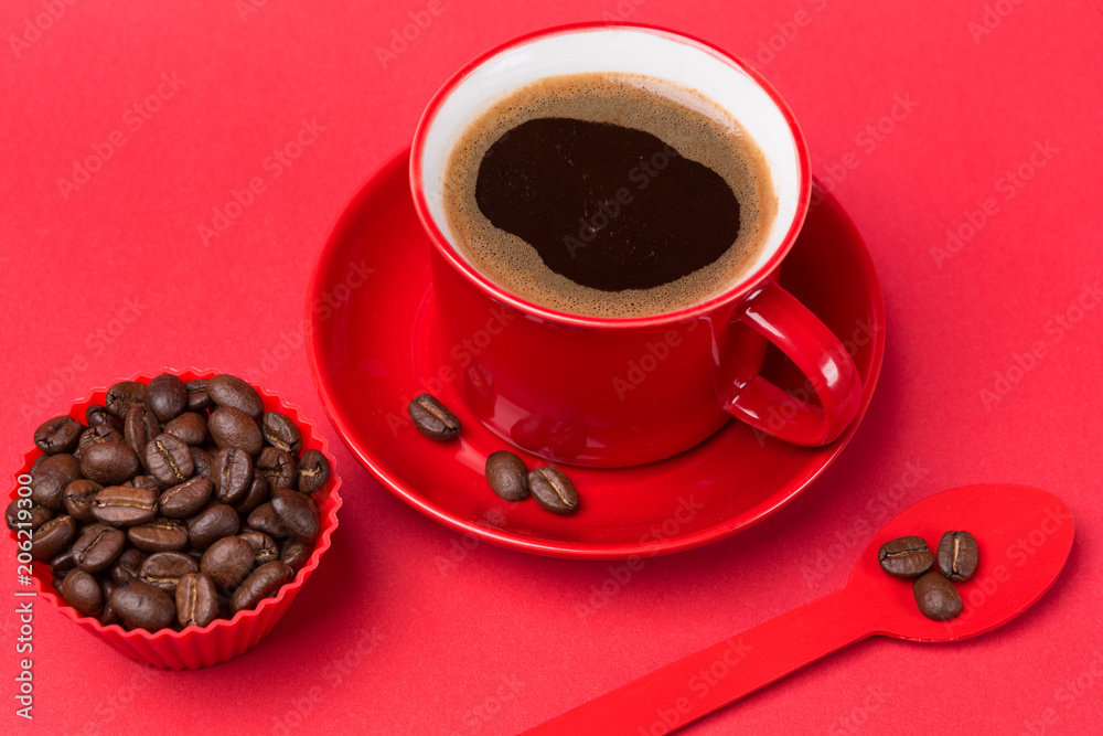 Obraz premium red cup with a drink of coffee with foam on a red background