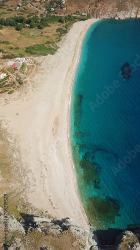 Aerial drone bird's eye view photo of iconic beach with turquoise clear waters located in Greek island