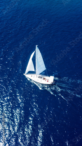 Aerial drone bird's eye view photo of luxury sail boat cruising in crystal clear waters of Ionian sea, Ionian islands, Greece