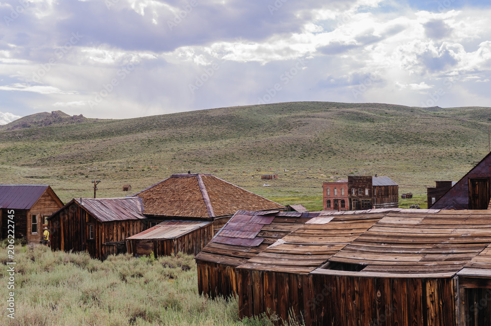 Ruined Buildings in the Californian Ghost Town of Bodie. Bodie is one of the best preserved Ghost Towns in America and was founded during the Californian Gold Rush. It was inhabited until the 1970s. 