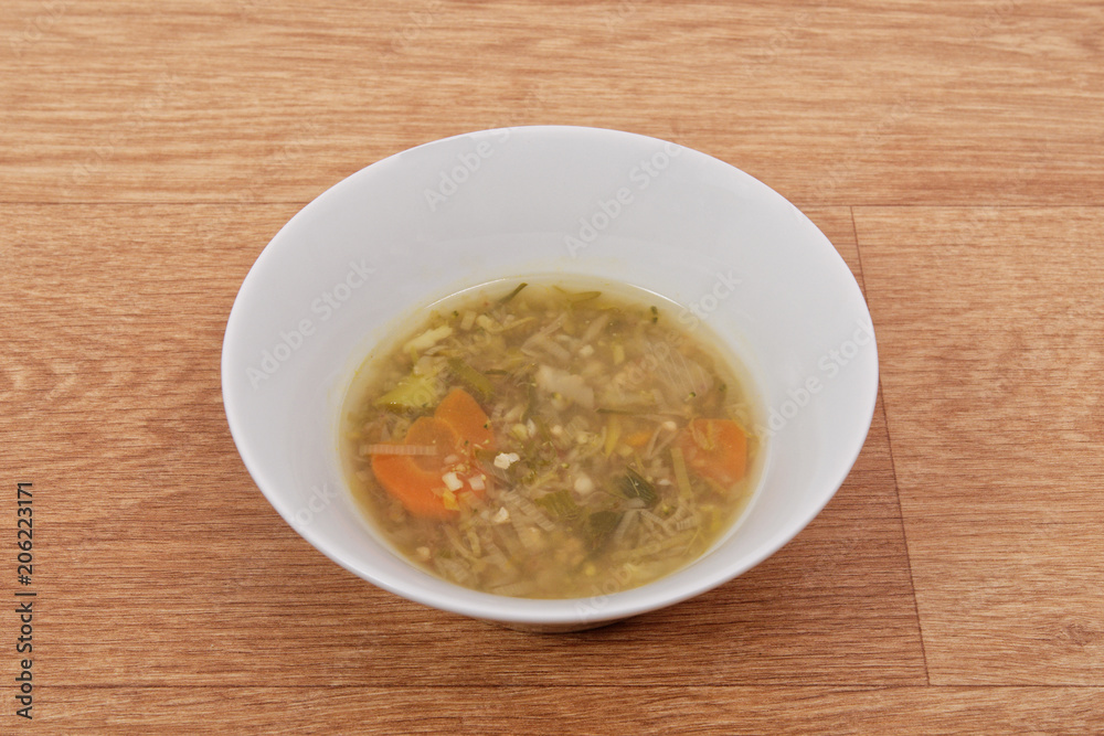 Miso vegetable soup with vegetables on a table Miso vegetable soup with vegetables on a table