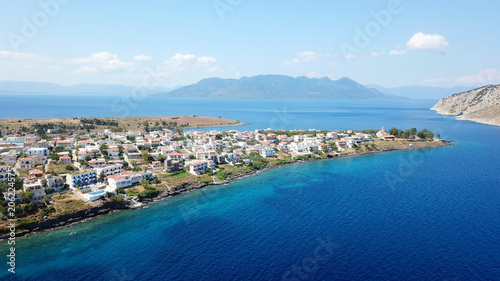 Fototapeta Naklejka Na Ścianę i Meble -  Aerial drone bird's eye view photo of port and traditional fishing village of Perdika in island of Aigina, Saronic Gulf, Greece