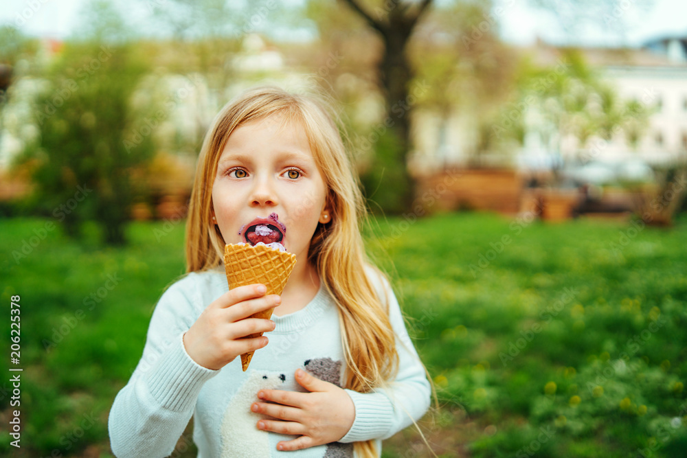 little pretty girl eating ice-cream outdoor little pretty girl eating ice-cream outdoor