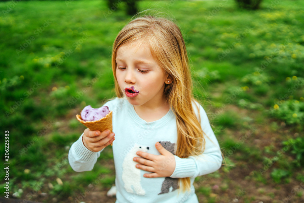 little pretty girl eating ice-cream outdoor little pretty girl eating ice-cream outdoor