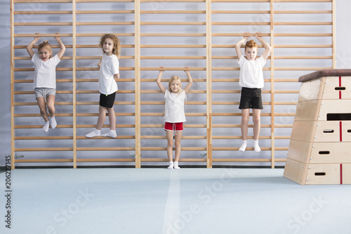 Photography School boys on wall bars