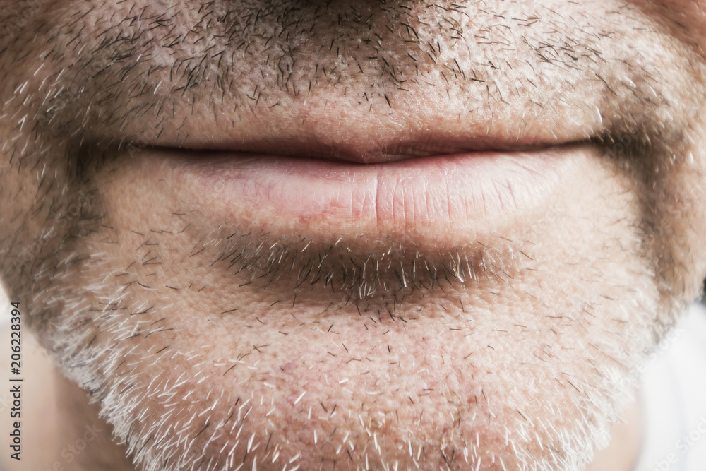 Part of men's face with bristles. Closeup, selective focus
