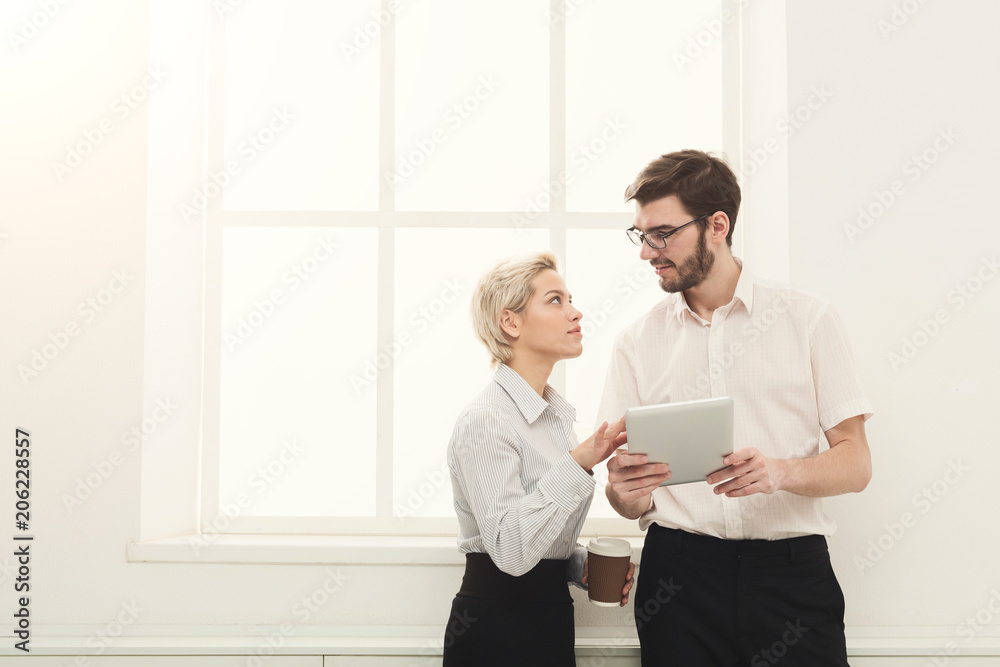 Fototapeta premium Couple of business partners work at modern office